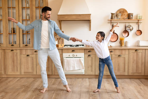 istock Father and daughter having a playful dance 2166434878