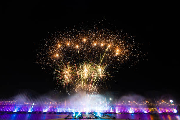istock Fire work with water fountain laser show. 2166435860