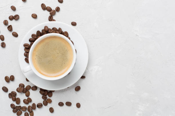 istock Cup of coffee on concrete background, top view 2166436190