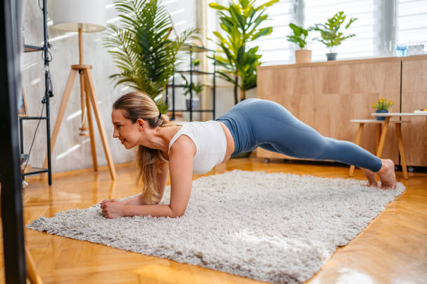 istock Young Woman Doing The Plank At Home 2166436912
