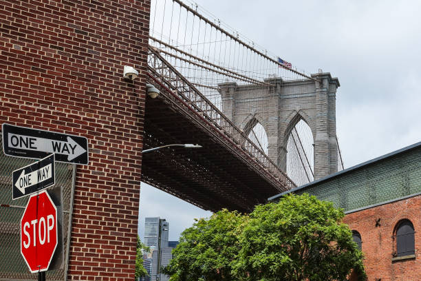 General view of Brooklyn Bridge with a Stop sign in New York City, New York, United States