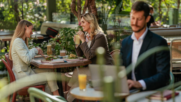 istock Two female friends enjoying a lunch together 2166438410