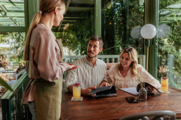 Couple ordering from a menu at the local cafe
