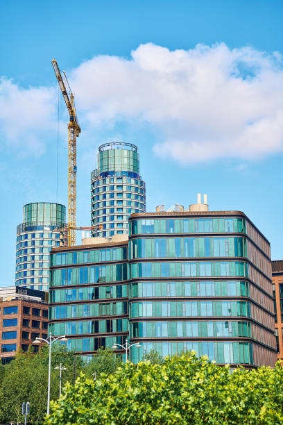 istock Construction crane building new office buildings in modern business district 2166440998