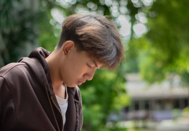 istock Depressed asian schoolboy 2166441035