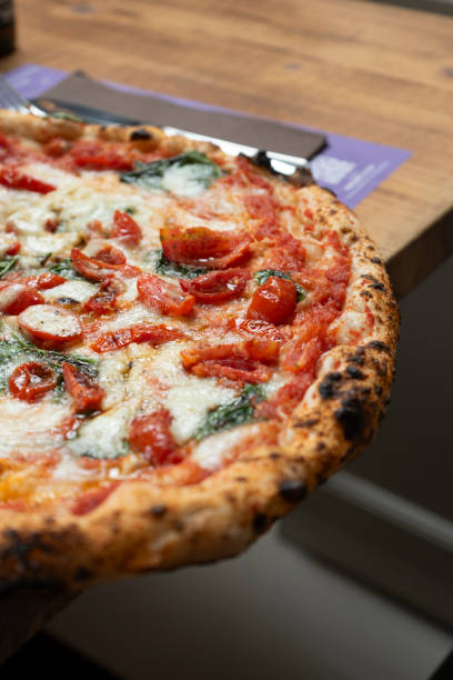 istock Neapolitan Margherita Pizza on the Restaurant Table 2166441796