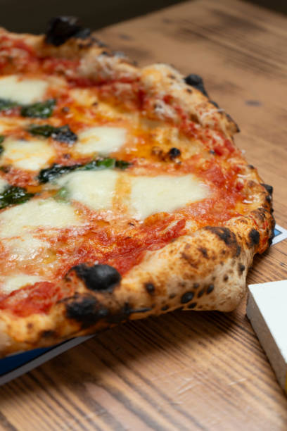 istock Neapolitan Margherita Pizza on the Restaurant Table 2166441809