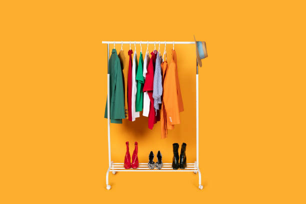 istock Rack of Clothes on Yellow Studio Background 2166442488