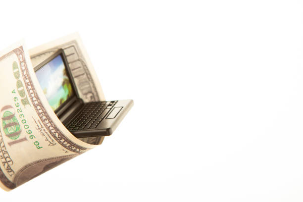 istock image of money banknote miniature computer 2166443389