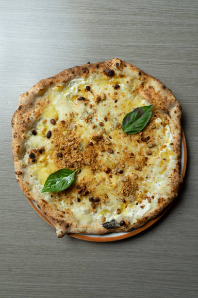 istock Pizza with crumbled tarallo and walnut cream from above 2166443875