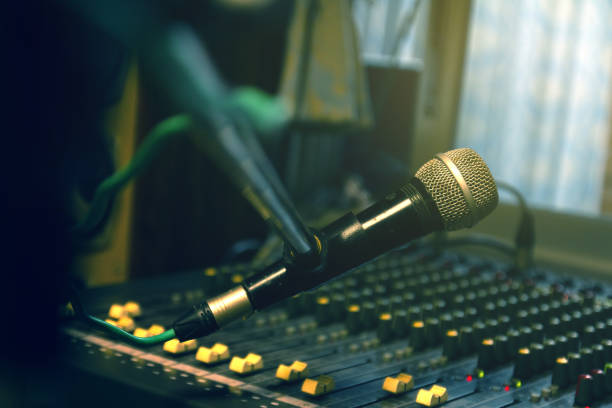 istock Microphone on stand in professional sound control room. 2166443963