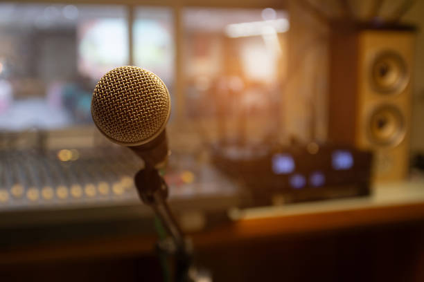 istock Microphone on stand in professional sound control room. 2166443977