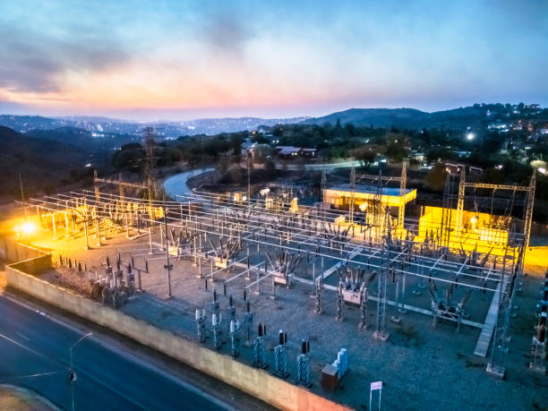 Electricity substation seen in the evening sunset in the valley, providing electrical power to the households.