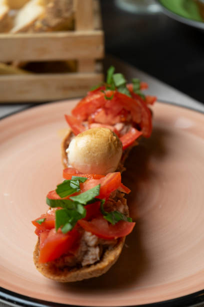 istock Plate with bruschetta tuna tomato basil and mozzarella 2166447456
