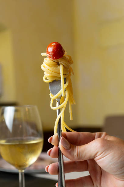 istock Faork holding spaghetti with tomato sauce 2166447475