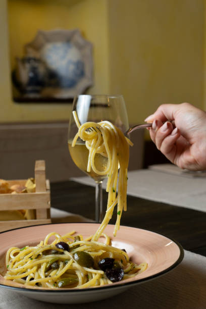 istock Faork holding spaghetti with tomato sauce 2166447495