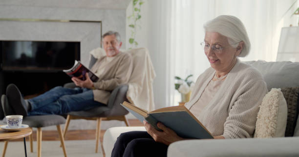 istock Elderly couple enjoying quiet reading time at home 2166448916
