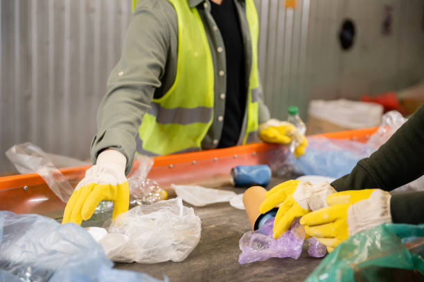 istock Volunteer sort waste for a cleaner community during a local eco initiative 2166450385