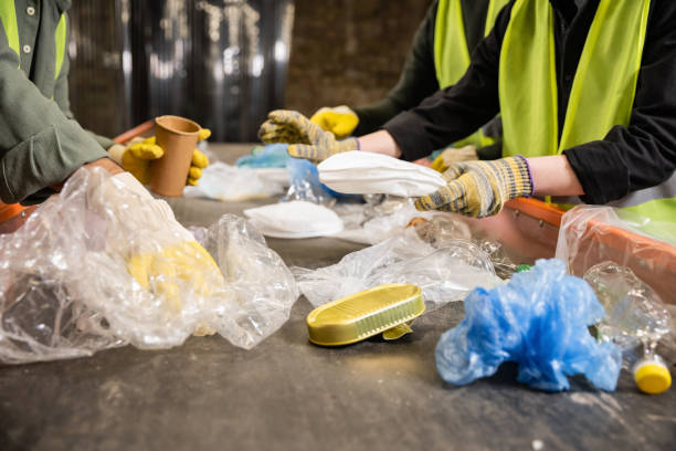 istock Volunteers sorting recyclables to promote a cleaner environment 2166450432