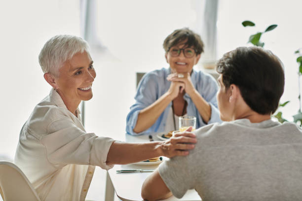 istock Joyful breakfast moment shared by a loving lesbian couple and their son in a bright kitchen 2166450985