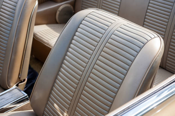 istock Brown leather seats in a vintage car, featuring detailed stitching 2166453045