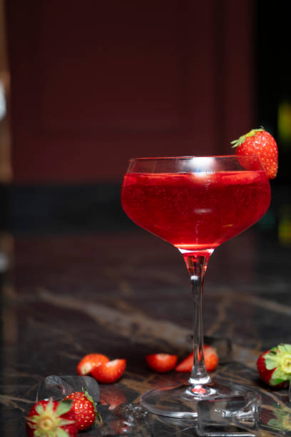 istock Red drink in a cup with fresh strawberries and ice 2166455958