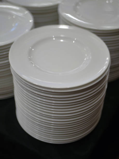 istock a pile of white plates 2166457333