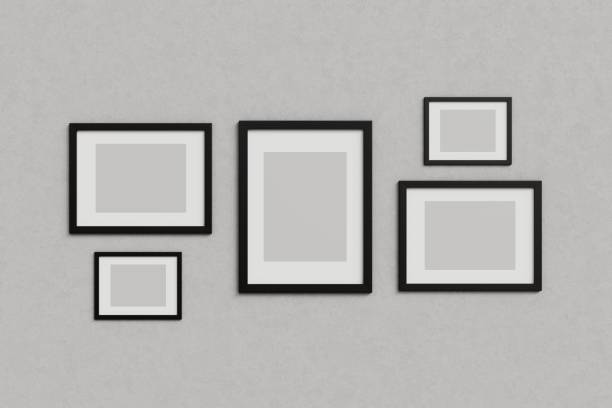 istock Black picture frames template on grey wall stock photo 2166457898