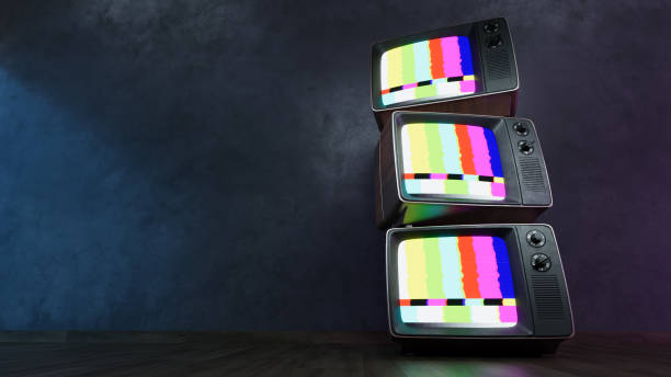 istock Stack of Vintage retro television on dark wooden background 2166459794