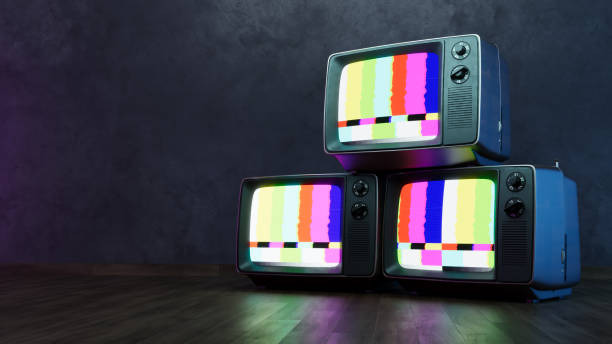 istock Stack of Vintage retro television on dark wooden background 2166459795
