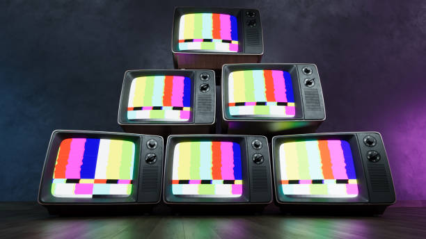 istock Stack of Vintage retro television on dark wooden background 2166460338