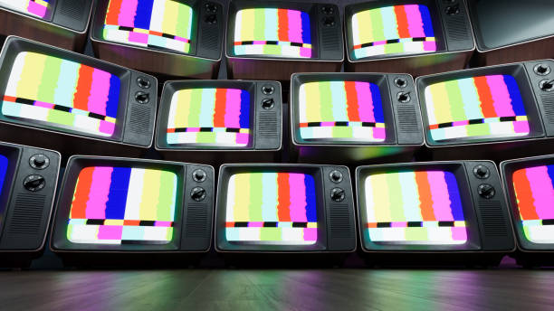 istock Stack of Vintage retro television on dark wooden background 2166460404