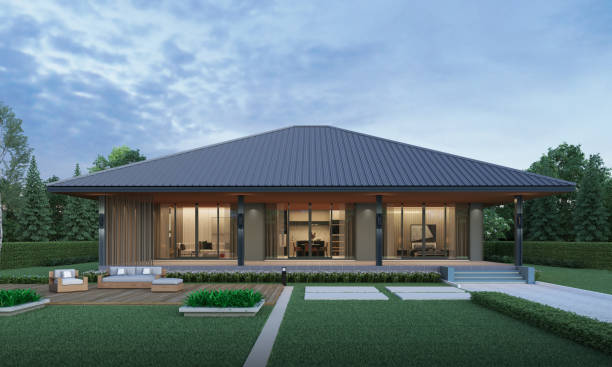 istock Modern house exterior evening view with lawn grass.3d rendering 2166461587