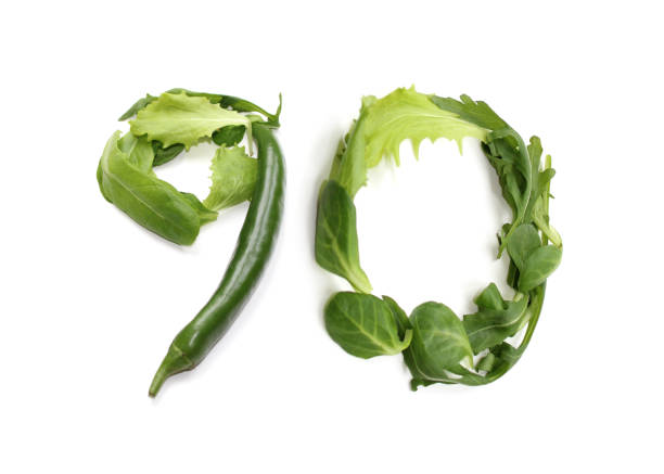 istock green anniversary number 90, ninety, from chilli pepper and salad lettuce leaf 2166463065