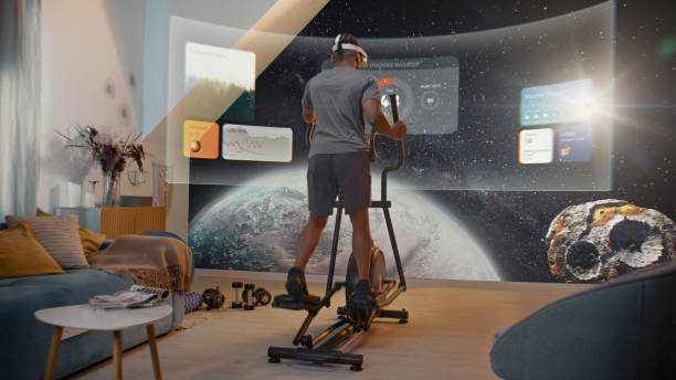 African American athlete training on orbitrek. Virtual screen with AR workout app