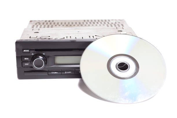 istock Old car radio with cd disk isolated on white background 2166467208