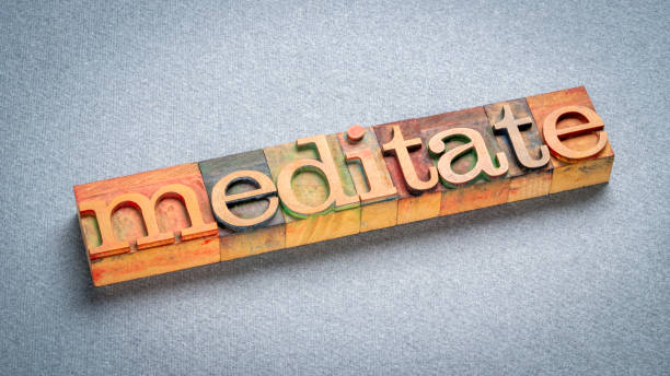 istock meditate word, text in retro letterpress wood type stained by color inks 2166467218