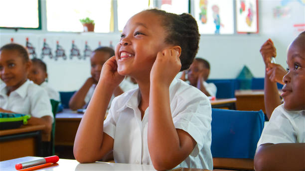 istock Joyful Schoolgirl Engages in Class Activity at Primary School 2166470795
