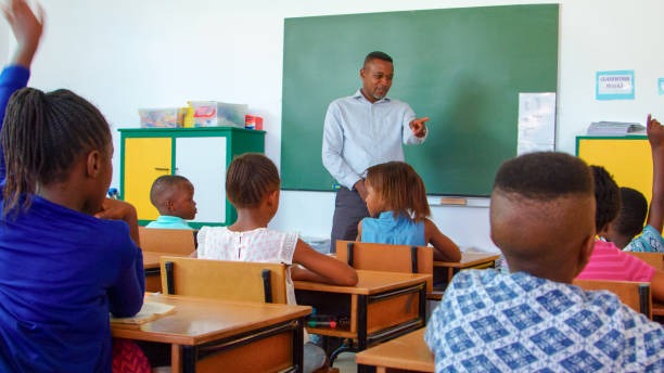 istock Teacher Engaging Students in Classroom During Lesson in Daylight 2166470854