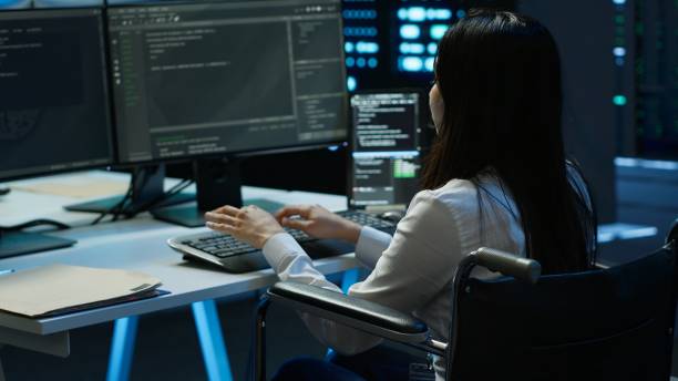 istock Person with paraplegia in inclusive server hub overseeing data center 2166471689