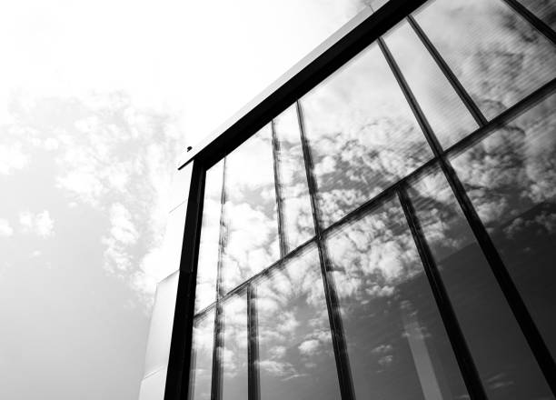 istock Low angle view of a modern building in black and white 2166471748