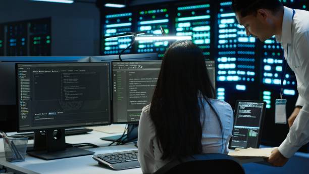 istock Team of programmers in data center responsible for repairs 2166472869