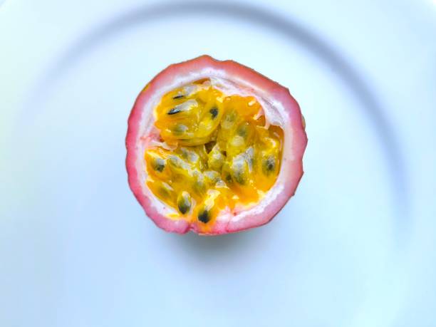 Passion fruit on a white ceramic plate