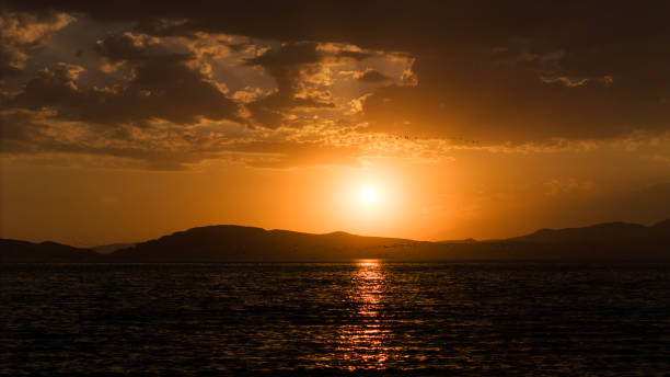 Sunset with sun and lake view