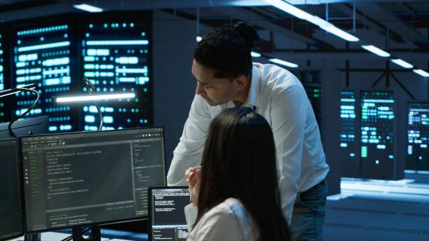istock Engineering team colleagues in data center managing gear energy consumption 2166473496