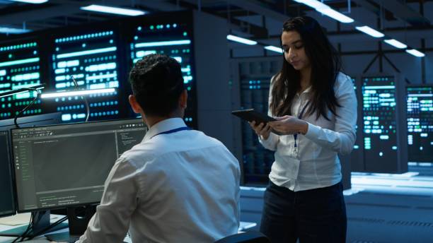 istock Coworkers in high tech data center monitoring security threats 2166473718