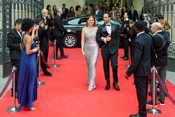 istock Well-dressed celebrity couple walking the red carpet 2166474470