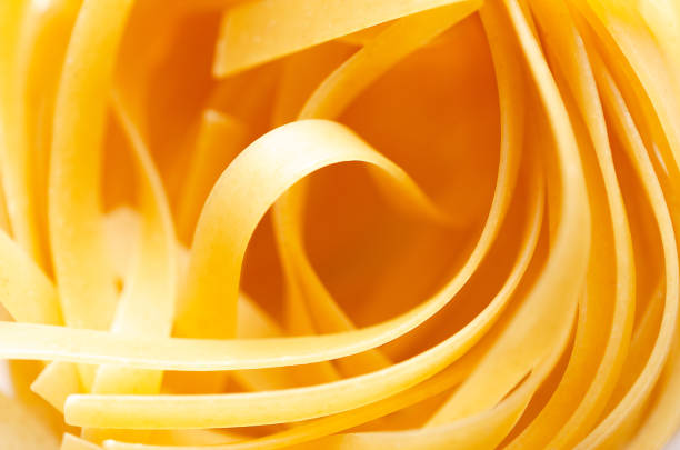 Close up of a nest of uncooked pasta.