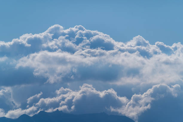 On a summer afternoon, elegant white clouds dance in the blue sky. The serene and mesmerizing scenery is a testament to the beauty of nature. Taiwan.