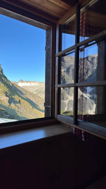 istock Morning view of mountains on a sunny day from a window with reflection, Austria 2166479469
